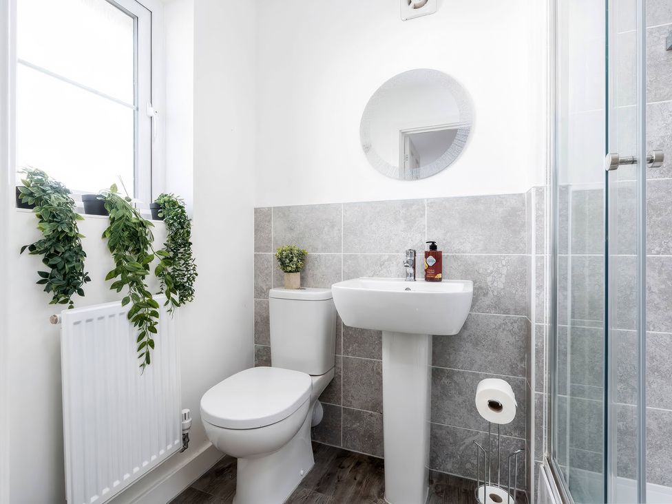 A bathroom with a sink and toilet at 59 Eagle Drive in Grimsby