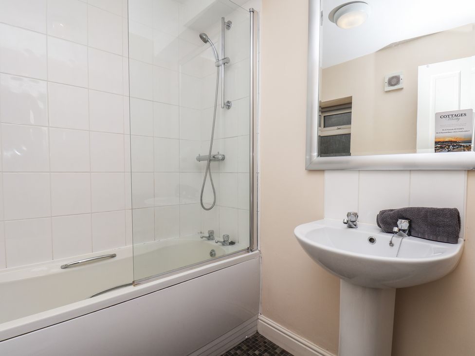 A bathroom featuring a bathtub and sink at Marina Side in Whitby