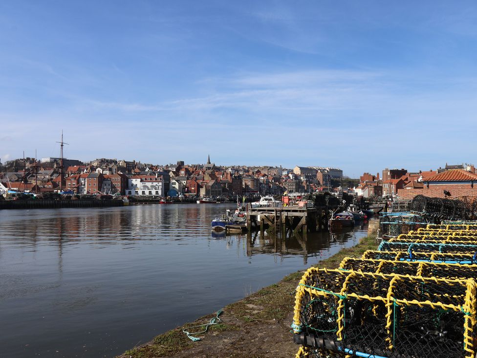 A harbor with boats and fishing nets at Marina Side in Whitby