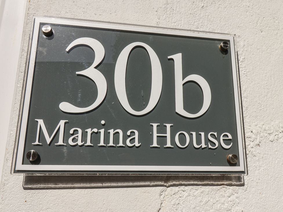 A sign displaying 30b Marina House