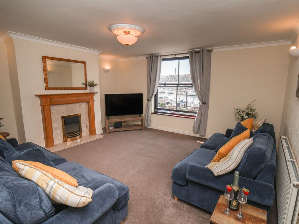 A living room with a television and fireplace at Marina House in Whitby