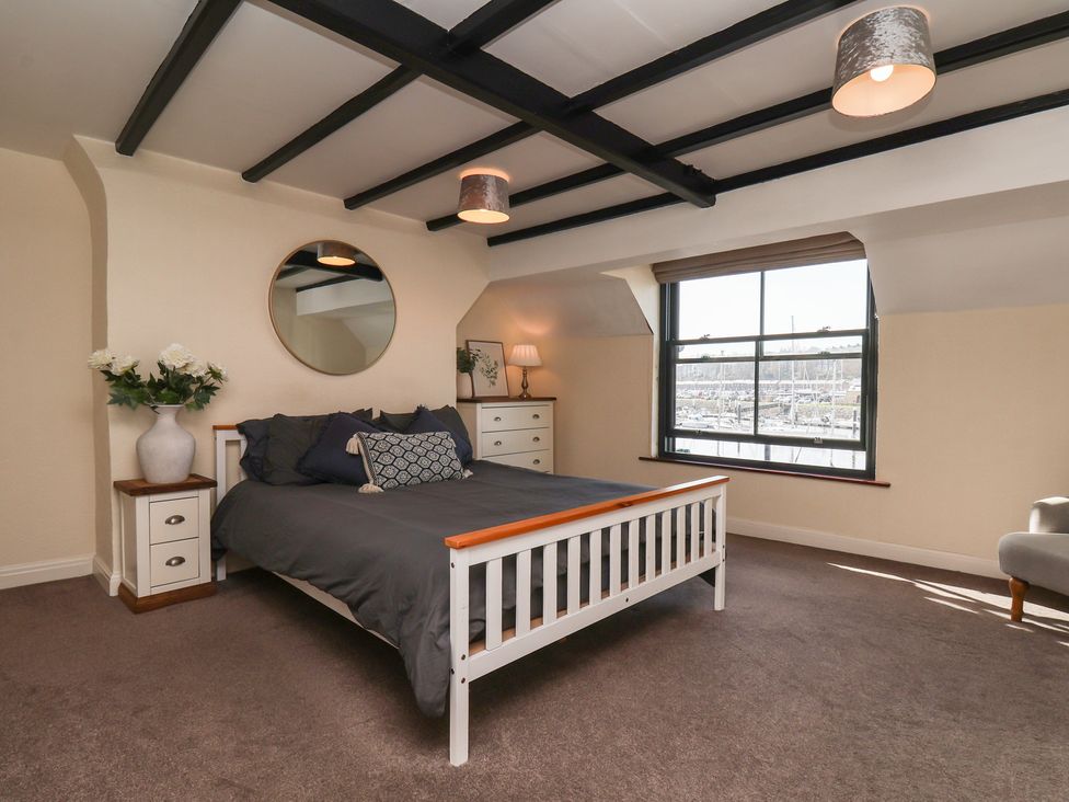 A bedroom with a bed and furniture at Marina House in Whitby