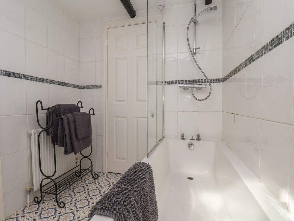 A bathroom with a bathtub and shower at Marina House in Whitby
