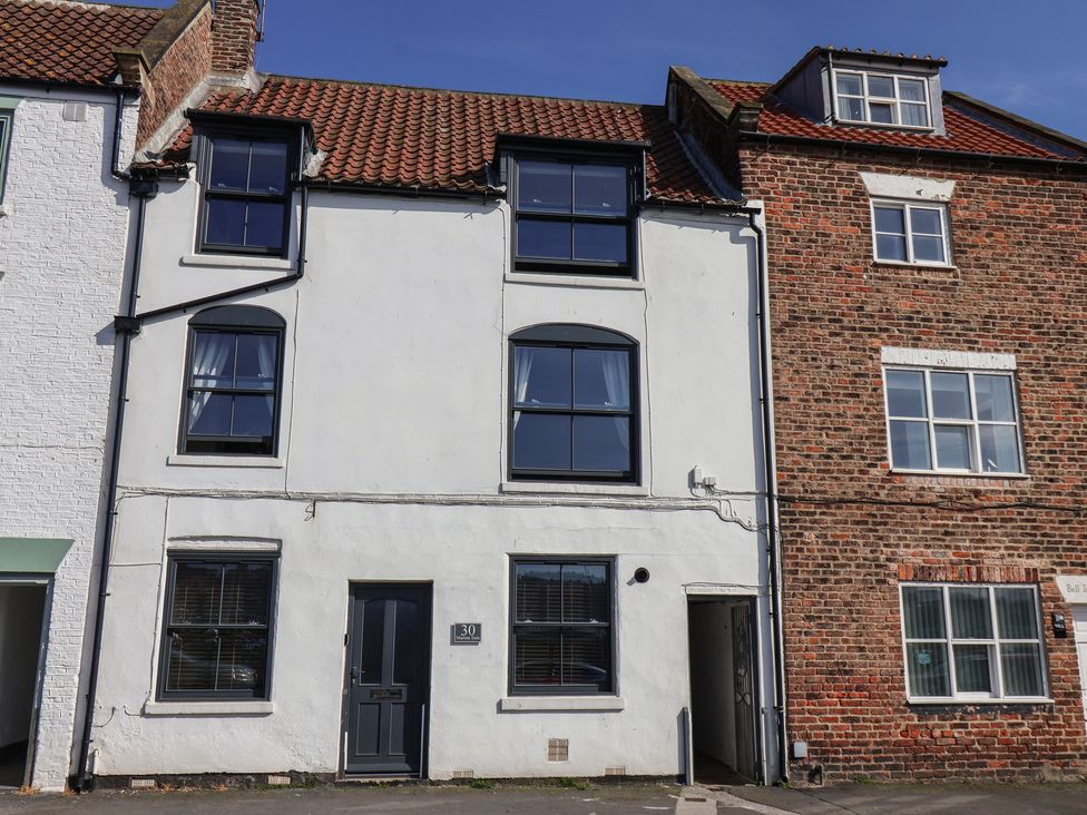 A house facade with windows and a door at Marina House in Whitby