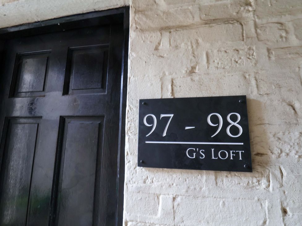 A door with a nameplate at G's Loft in Whitby