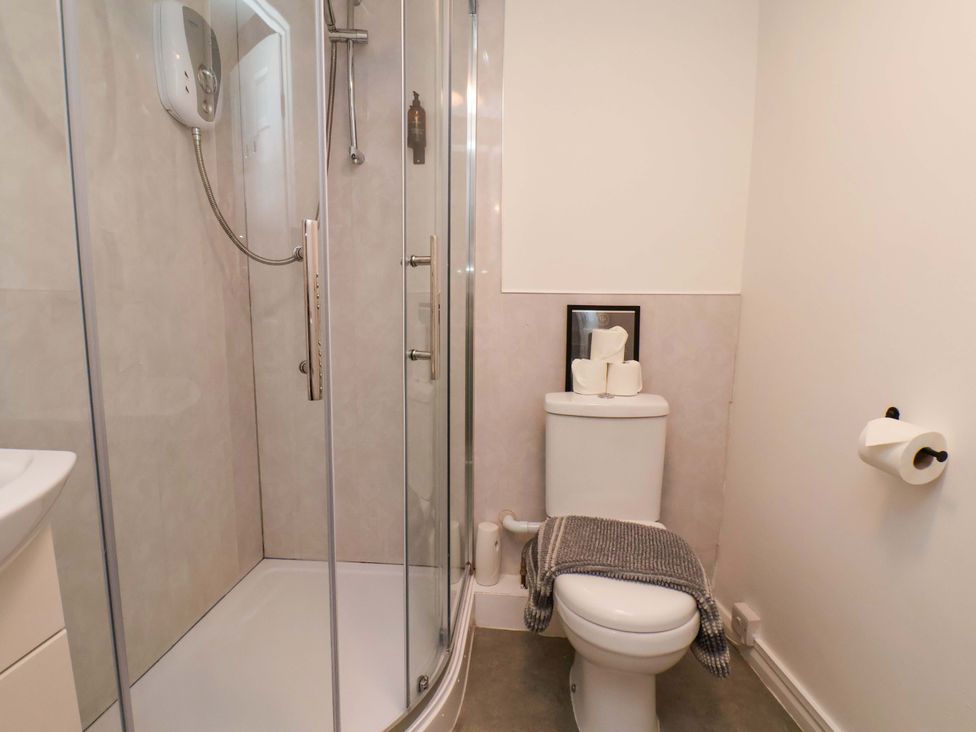 A bathroom with a shower and toilet at G's Loft in Whitby