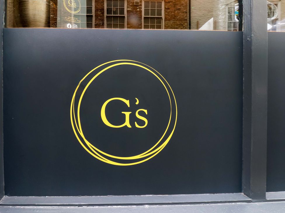 A sign with the logo of G's at G's Loft in Whitby