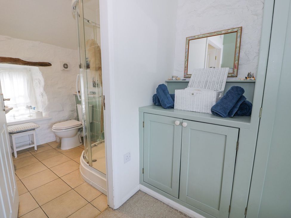 A bathroom with a shower and toilet at Happy Landing in Harlech