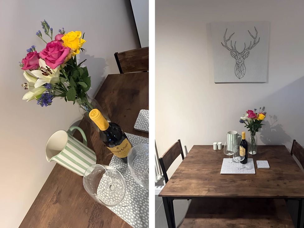 A dining room with a table set for drinks at 1-Bed House, Sleeps 4, Free Parking