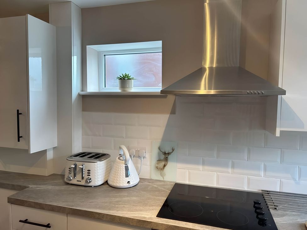 A kitchen with a kettle and toaster on the counter at 1-Bed House, Sleeps 4, Free Parking