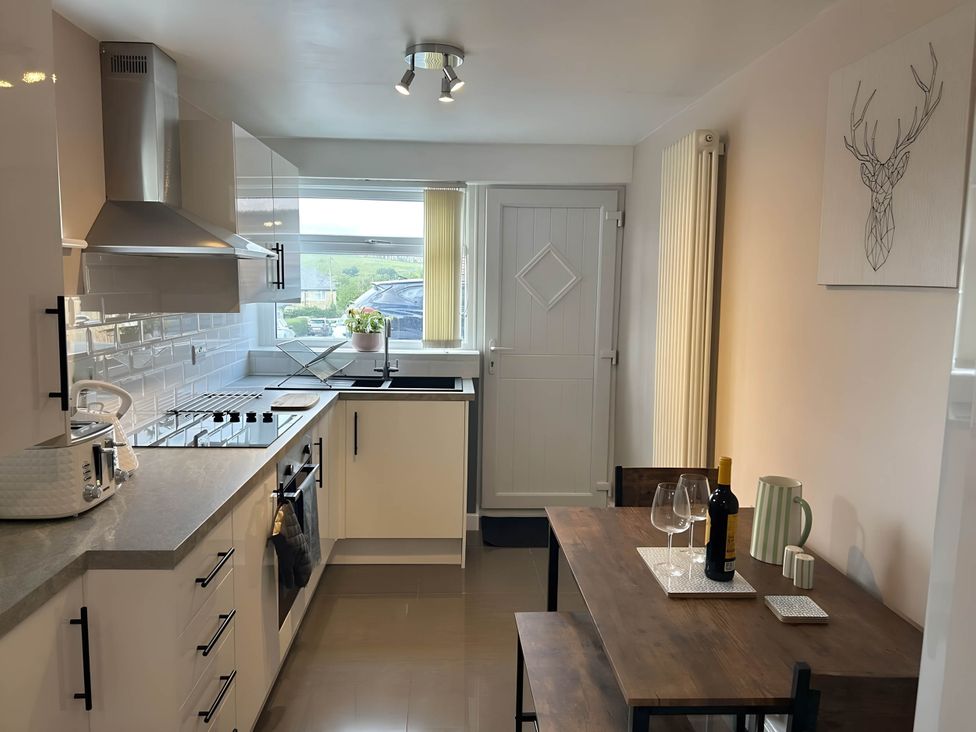 A kitchen with a table and chairs at 1-Bed House, Sleeps 4, Free Parking