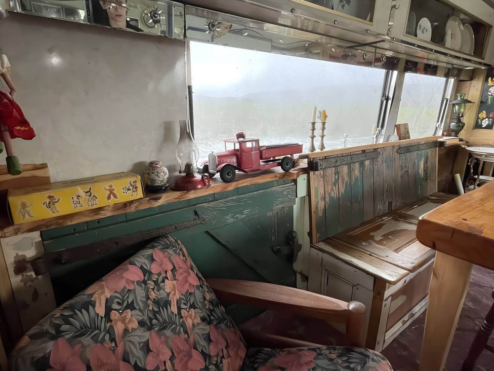 A living room with a toy truck and a lantern at 2 x Double Bed Glamping Wagon at Dalby Forest Scarborough