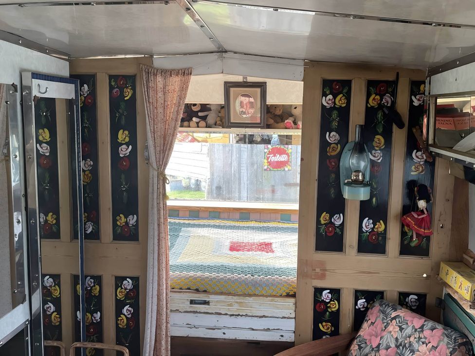 A glamping wagon interior with a bed and window at 2 x Double Bed Glamping Wagon at Dalby Forest Scarborough