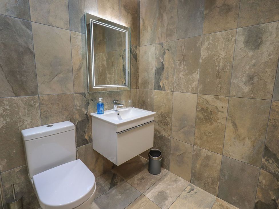 A bathroom with a sink and toilet at Orcaber Farm Retreat in Lancaster