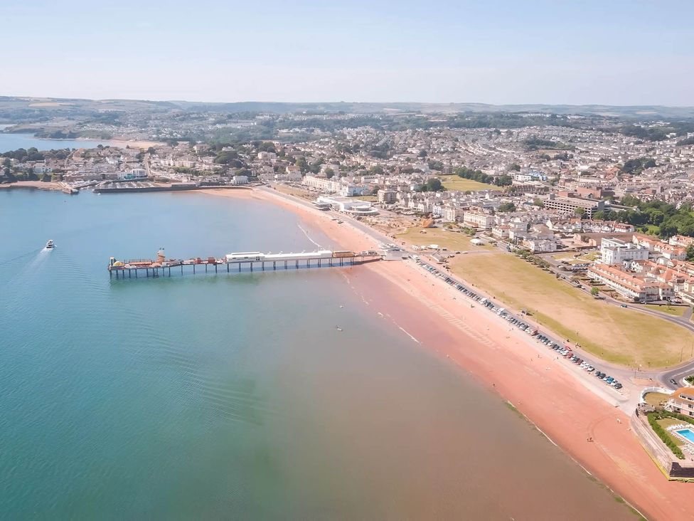 An aerial view of a beach with a pier and nearby town at Static Caravan Mallard Rise 22 Hoburne Devon Bay, Paignton