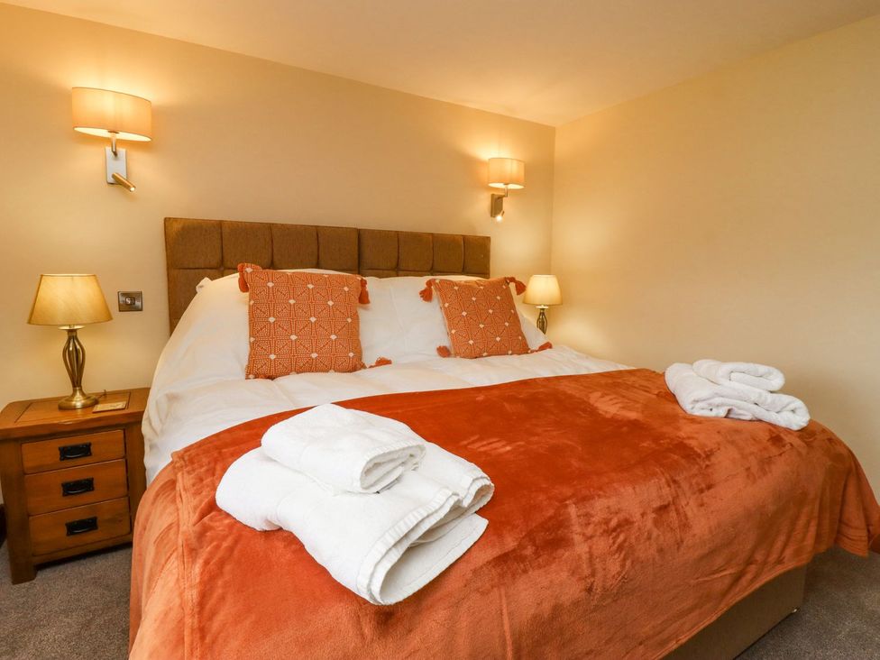 A bedroom with a bed and pillows at Orcaber Farmhouse in Lancaster