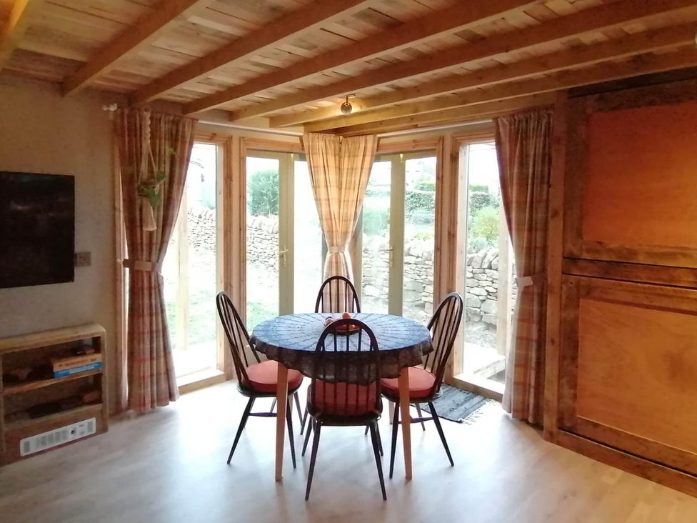 A dining room with a table and chairs at Stone Moor Lodge, Justin's Peak District Base Camp, Sheffield