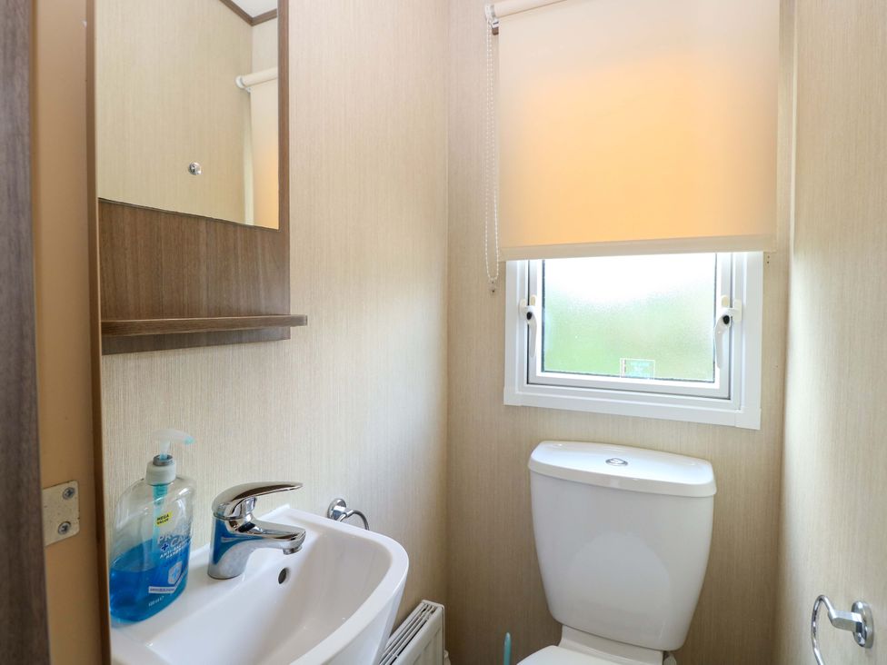 A bathroom with a sink and toilet at PK Sunset View in Corton