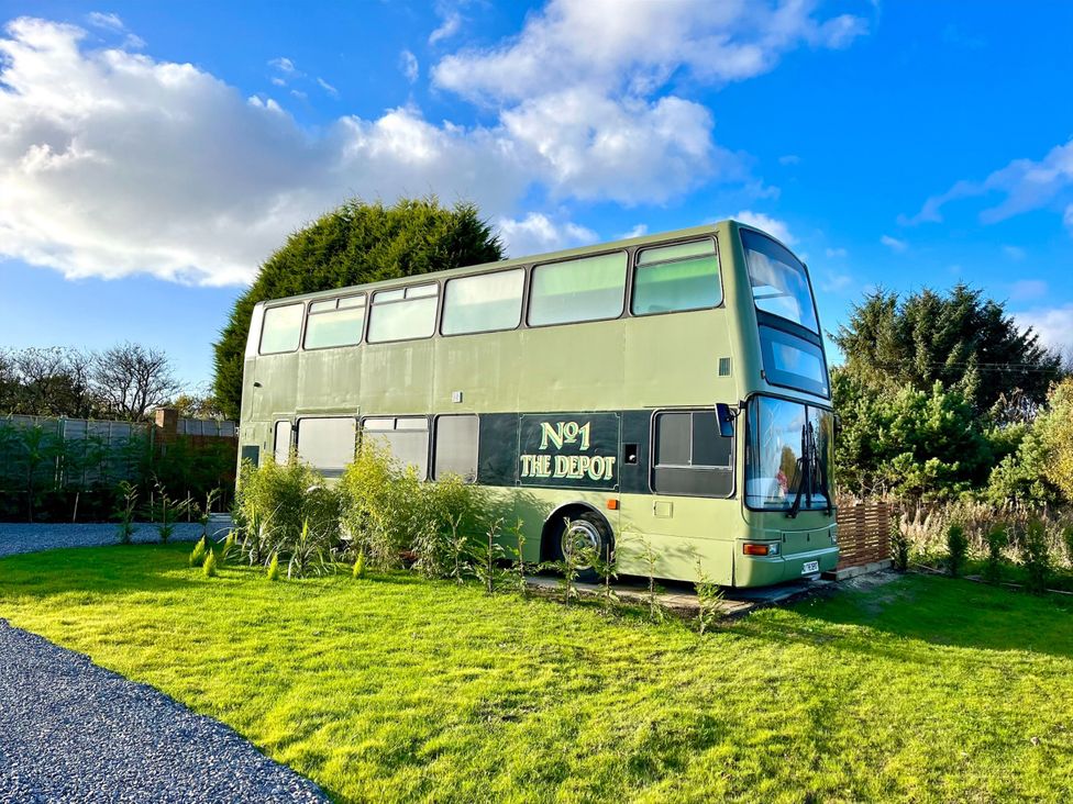 A double-decker bus in a garden at No 1 The Depot in Gateshead