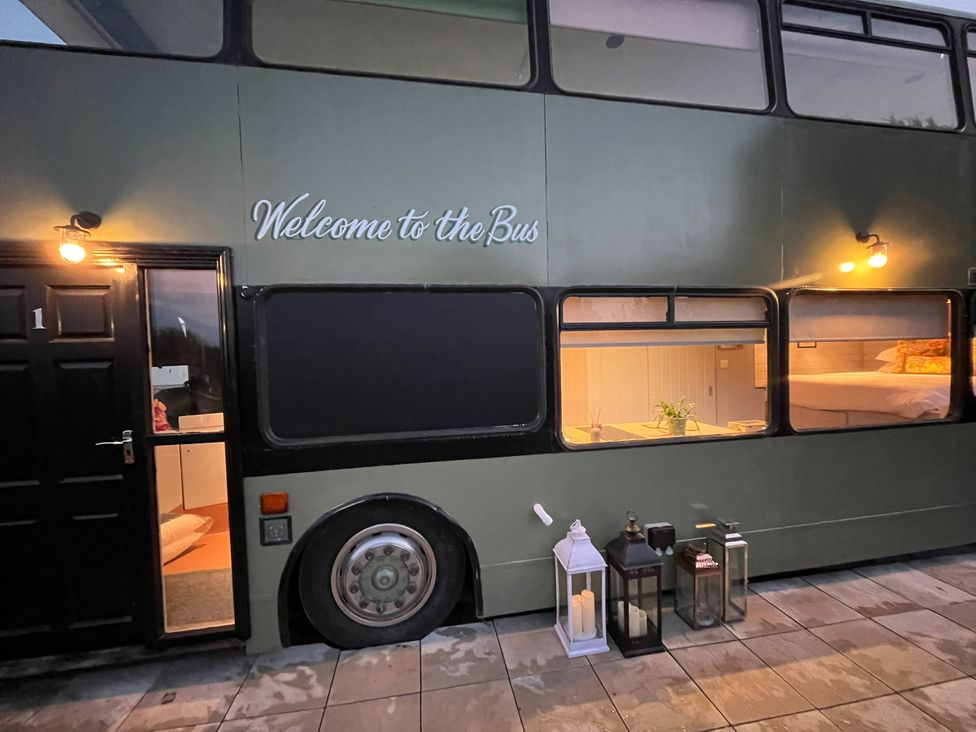 An outdoor view of a bus with a door and window at No 1 The Depot in Gateshead