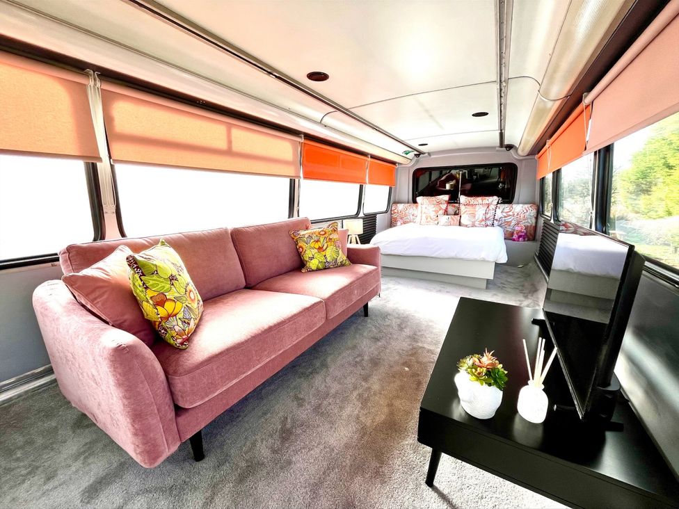 A living room with a sofa and bed at No 1 The Depot in Gateshead