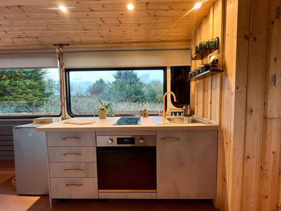 A kitchen with a stove and sink at No 1 The Depot in Gateshead