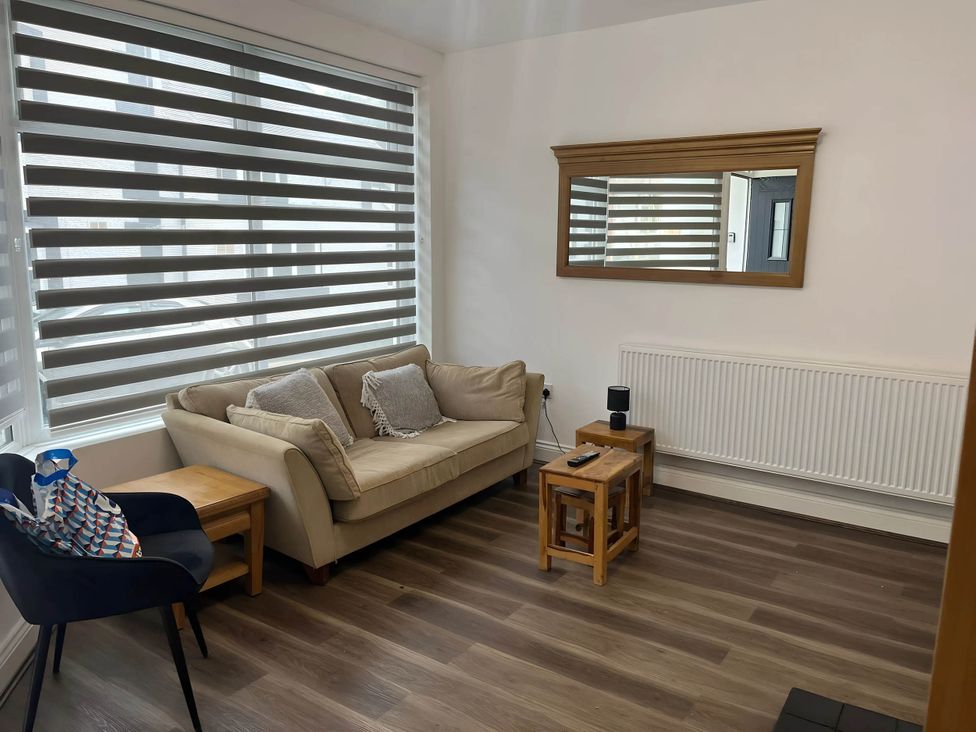 A living room with a sofa and coffee table at Llangollen - House - Sleeps 8- Garden in Llangollen