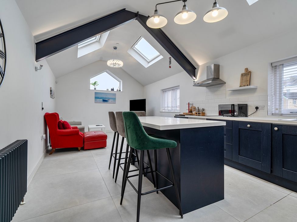 A kitchen with a styled island and seating area at Modern Seaside Cottage - Sleeps 5 in Paignton