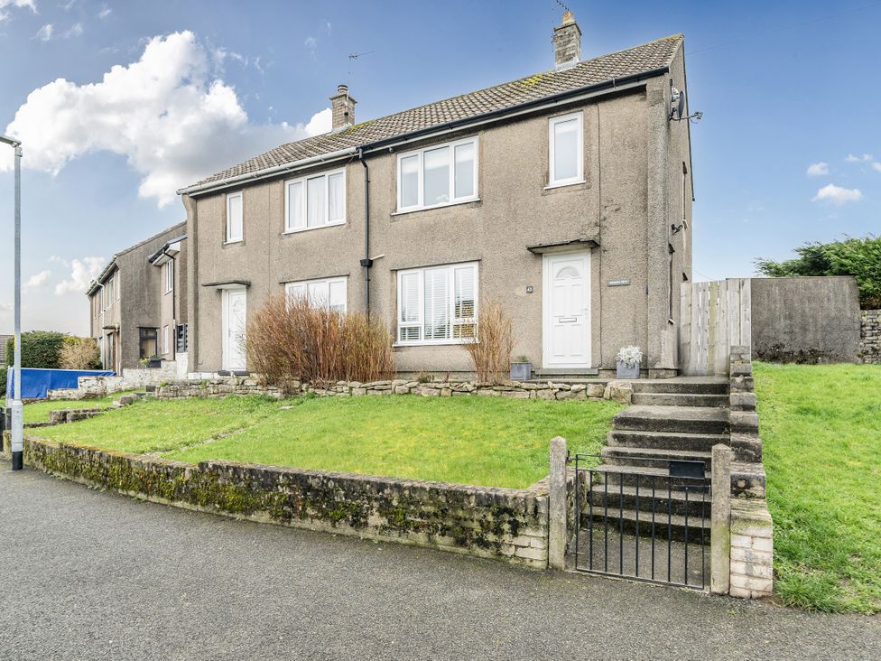 A house with steps and a gate at 2 Bed House - Sleeps 4 - Garden - Parking - Wifi in Kendal