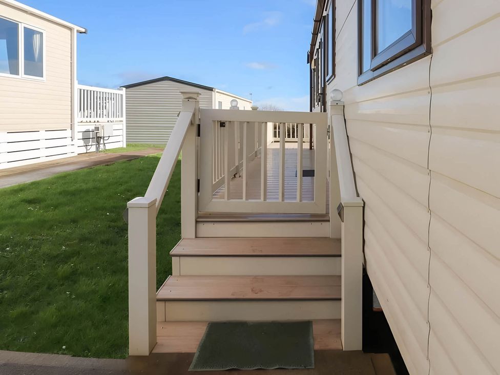 Stairs leading to a doorway at CaravanSleeps6-FreeParking-QuietRetreat-Nature in Paignton
