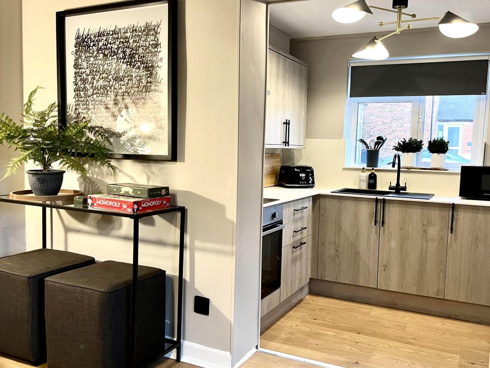 A kitchen with a counter, cabinets, and a sink at Central Ellesmere - Stay 2 - Parking - PetFriendly