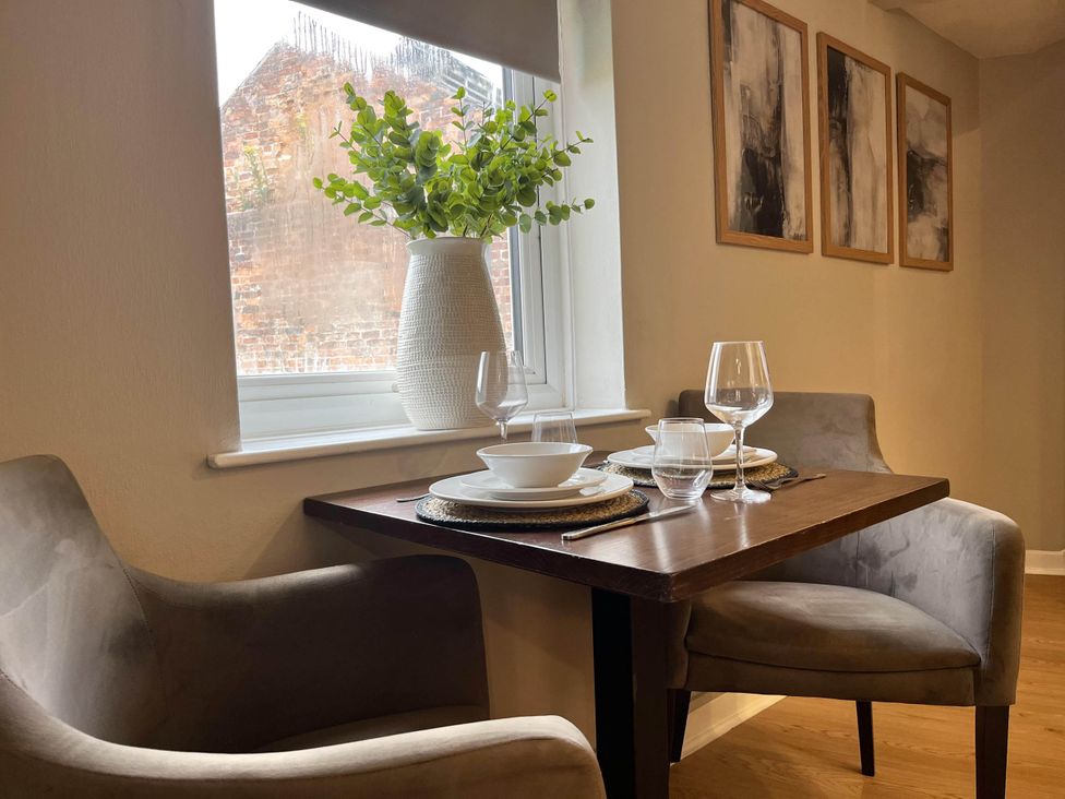 A dining area with a table and chairs at Central Ellesmere - Stay 2 - Parking - PetFriendly