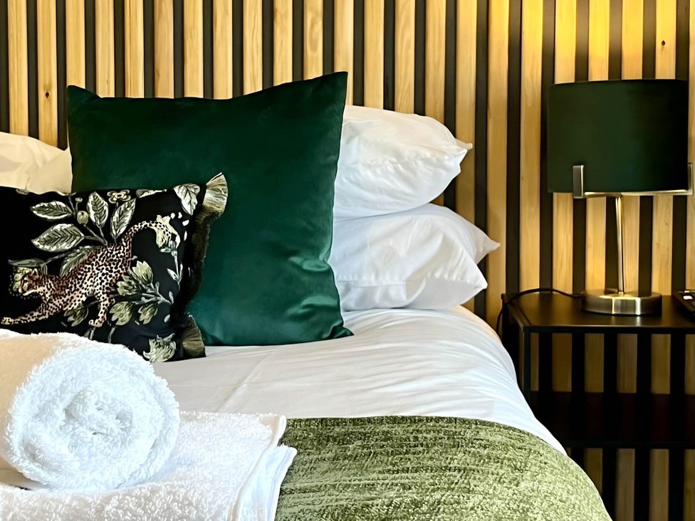 A bedroom with a bed and pillows at Central Ellesmere - Stay 2 - Parking - PetFriendly