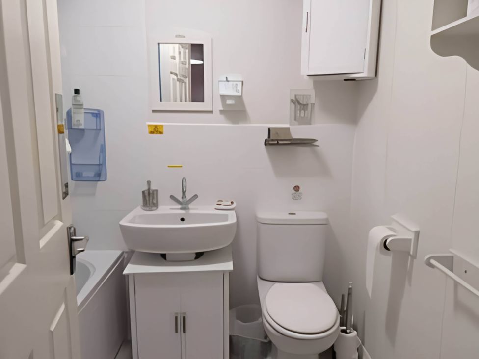 A bathroom with a sink and toilet at 2 Bed House - Sleeps 6 - Pets - Garden - Parking