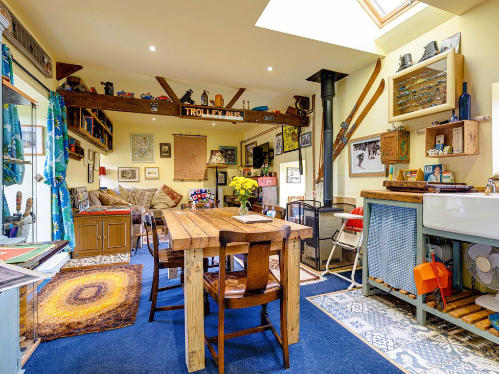 A living room with a table and sofa in Family Country Cottage with a private Valley View