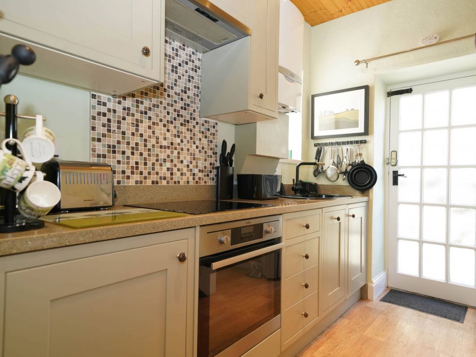 A kitchen with appliances and utensils at Traditional 2 Bedroom Cottage in Eyam, Hope Valley