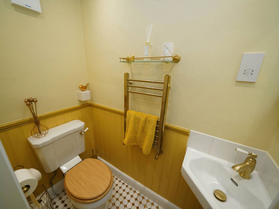 A bathroom with a toilet and sink at Traditional 2 Bedroom Cottage in Eyam, Hope Valley