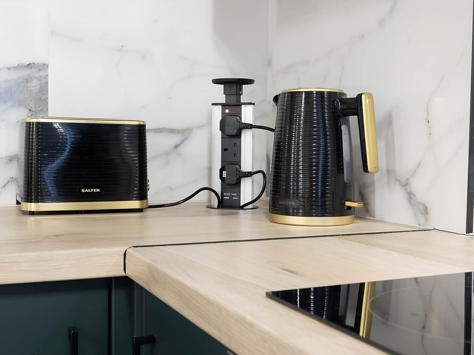 A kettle and toaster on a countertop in a kitchen at CentralEllesmere - Sleeps4 - Parking - PetFriendly