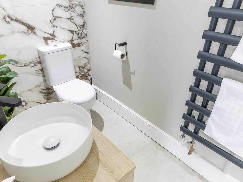 A bathroom with a toilet and a sink at CentralEllesmere - Sleeps4 - Parking - PetFriendly