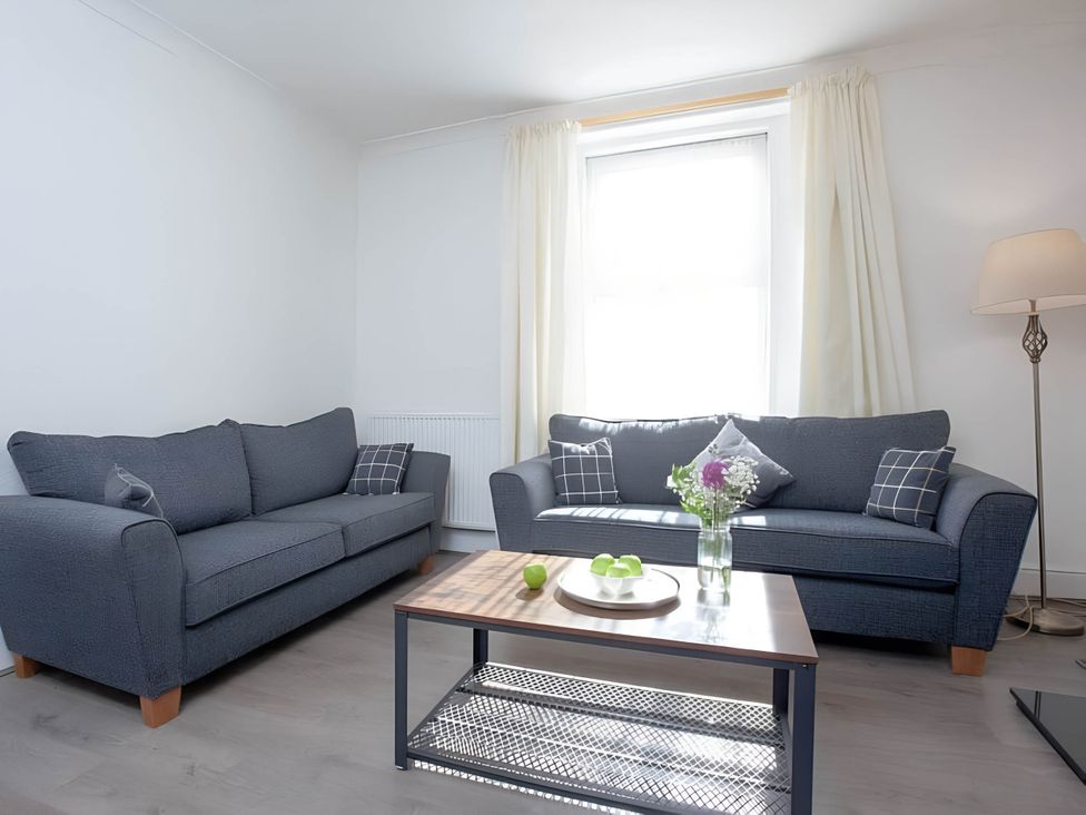A living room with sofas and a coffee table at Torquay - House - Sleeps 6 - Pet Friendly