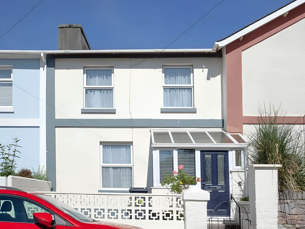 A house with a garden and car at Torquay - House - Sleeps 6 - Pet Friendly