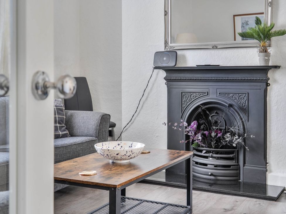 A living room with a sofa and coffee table at Torquay - House - Sleeps 6 - Pet Friendly, Torquay