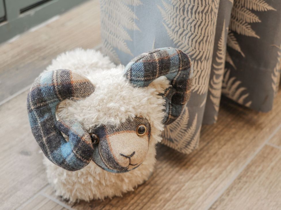 A stuffed animal with horns near a curtain at Little Esklets in Whitby