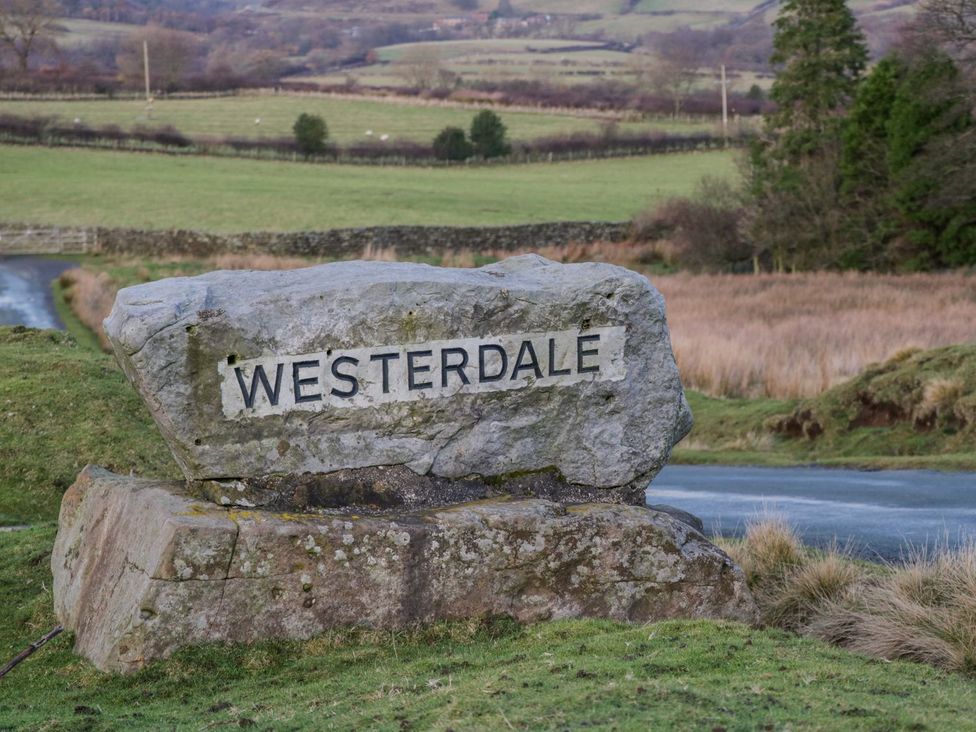 A welcome sign on a rock at Westerdale in Whitby