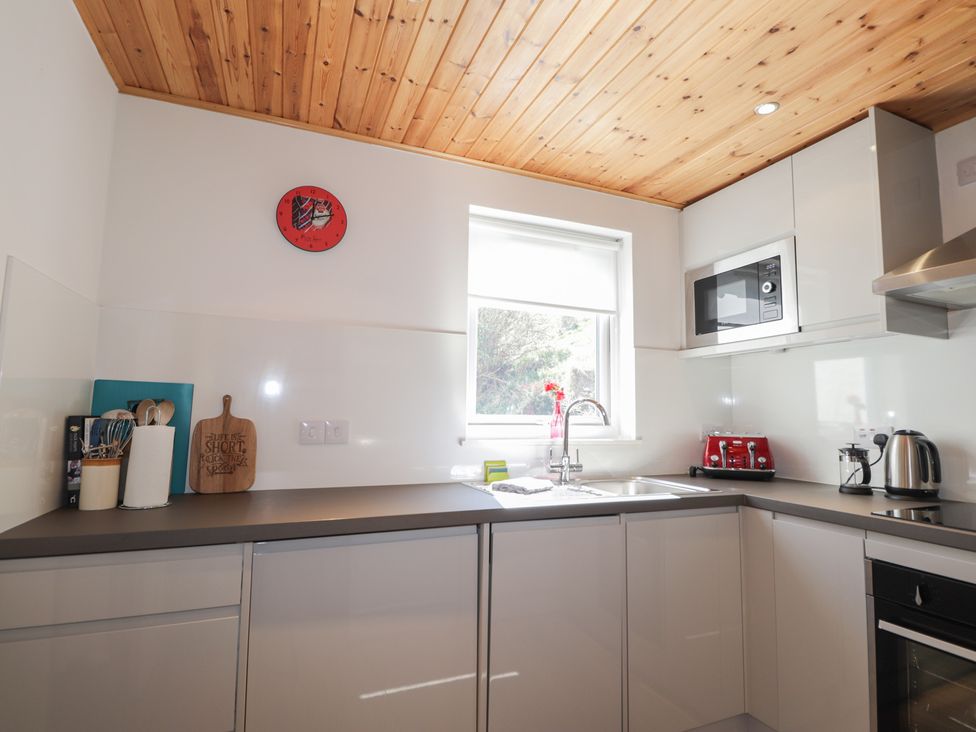 A kitchen with a sink and microwave at Tigh a Phailean in Letterfearn