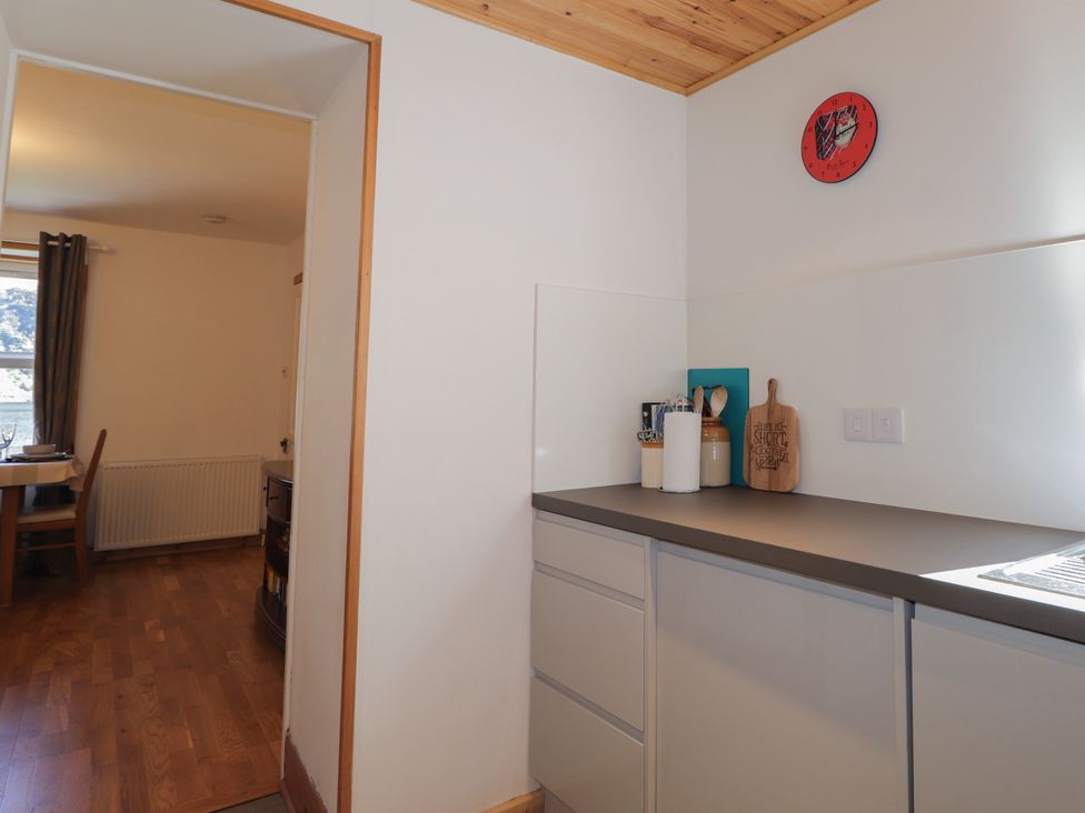 A kitchen with cabinets and a sink at Tigh a Phailean in Letterfearn