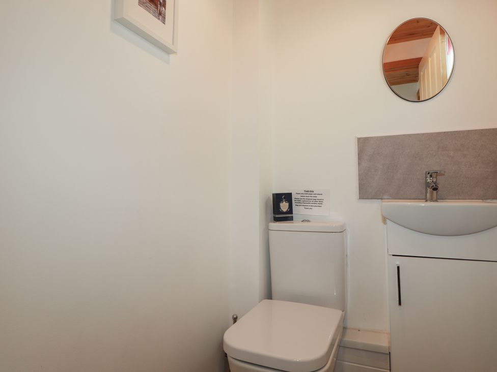 A bathroom with a toilet and sink at Tigh a Phailean in Letterfearn