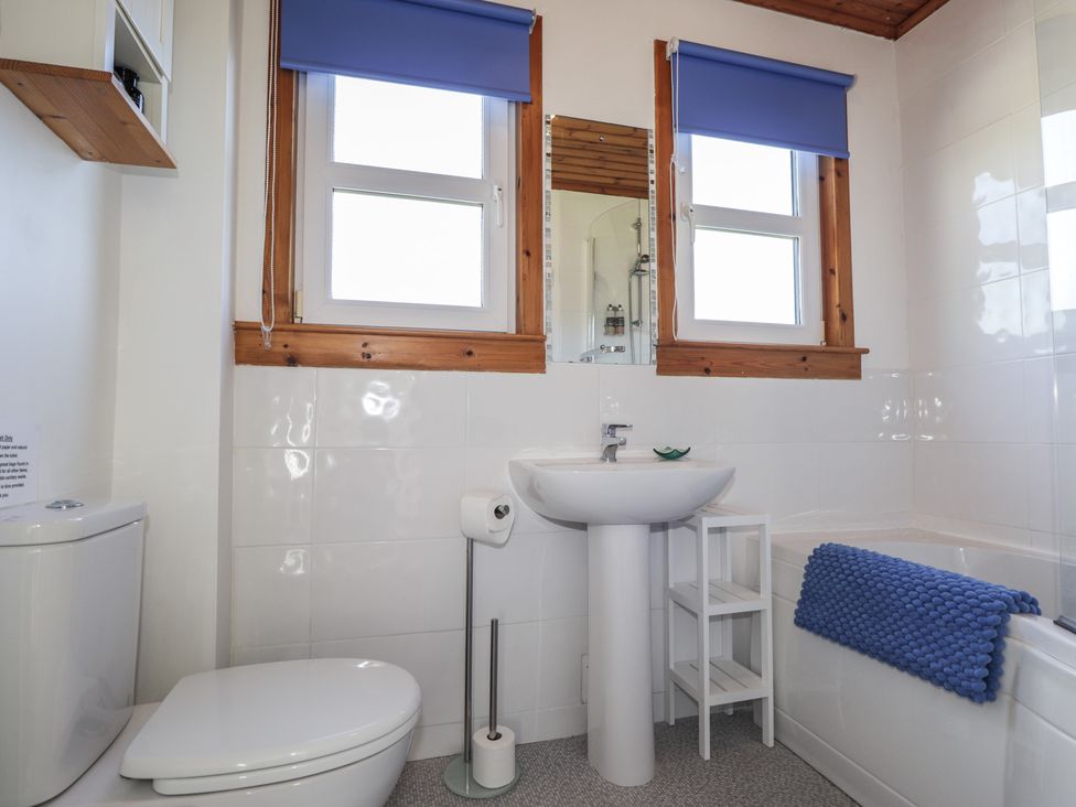 A bathroom with a sink, toilet, and bathtub at Tigh a Phailean in Letterfearn