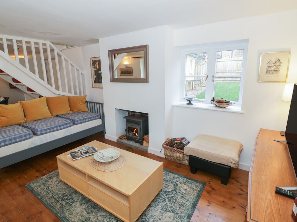 A living room with a sofa and a coffee table at Ambercote in Priors Marston near Southam