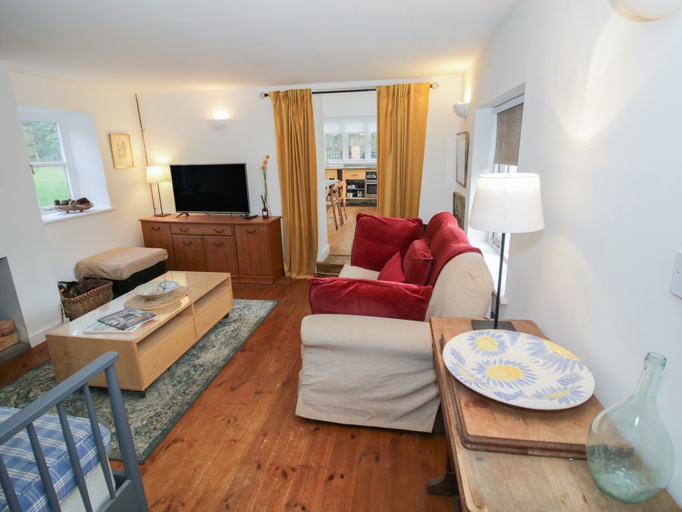 A living room with a sofa and television at Ambercote in Priors Marston near Southam